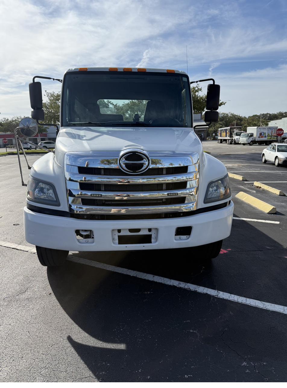 Hammond Towing Hino rollback flatbed truck, front view